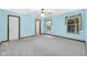 Bright bedroom with two windows, ceiling fan, and light blue walls at 9735 Woodsong Ln, Indianapolis, IN 46229