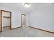 Spacious bedroom features plush carpet and ample closet space for comfortable living at 9735 Woodsong Ln, Indianapolis, IN 46229