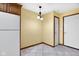 Eat-in kitchen area featuring a tiled floor and white appliances at 9735 Woodsong Ln, Indianapolis, IN 46229