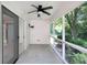 Relaxing screened porch offers an outdoor living area with views of the landscaped backyard at 9735 Woodsong Ln, Indianapolis, IN 46229