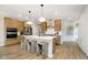 Spacious kitchen featuring an island with seating, stainless steel appliances, and modern cabinetry at 9737 Oleander Dr, Fishers, IN 46250