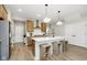 Well-designed kitchen with an island, wooden cabinets, stainless steel appliances, and pendant lighting at 9737 Oleander Dr, Fishers, IN 46250
