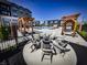 Inviting outdoor seating area with fire pit, ideal for gathering and enjoying community amenities at 9737 Oleander Dr, Fishers, IN 46250