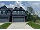 Charming two-story home with a well-manicured lawn and a spacious two-car garage, creating an inviting curb appeal at 9751 Behner Dr, Fishers, IN 46250