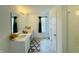 Bathroom featuring double vanity, ample cabinet space, and neutral-toned flooring at 980 S Raylee Garden Dr, New Palestine, IN 46163