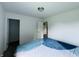 Bedroom featuring access to a closet and a view from the window to the outside at 980 S Raylee Garden Dr, New Palestine, IN 46163