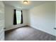 Cozy bedroom featuring neutral carpet, natural light, and simple decor at 980 S Raylee Garden Dr, New Palestine, IN 46163