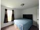 Bedroom with carpet flooring and a view from the window to the outside at 980 S Raylee Garden Dr, New Palestine, IN 46163
