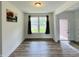 Inviting dining room featuring hardwood floors and a view of the front yard at 980 S Raylee Garden Dr, New Palestine, IN 46163