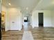 Bright entryway with hardwood floors, leading to various rooms in the home at 980 S Raylee Garden Dr, New Palestine, IN 46163