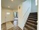 Welcoming foyer with staircase, stylish rug, and modern decor creates an inviting entrance at 980 S Raylee Garden Dr, New Palestine, IN 46163