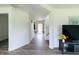 Hallway featuring hardwood floors, and a view of the entryway and staircase at 980 S Raylee Garden Dr, New Palestine, IN 46163