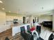 Open kitchen, dining, and living space is great for entertaining in the home at 980 S Raylee Garden Dr, New Palestine, IN 46163