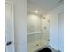 Walk-in shower featuring subway tile surround, glass enclosure, and bench at 980 S Raylee Garden Dr, New Palestine, IN 46163