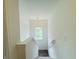Stairwell illuminated by a pendant light, leading to the upper level, with a window at 980 S Raylee Garden Dr, New Palestine, IN 46163
