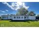 Charming single-story home featuring a well-maintained lawn and an attached garage at 10 Lincoln Cir, Elwood, IN 46036