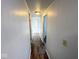 Clean hallway with wood flooring connecting multiple rooms at 10 Lincoln Cir, Elwood, IN 46036