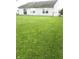 View of the fenced backyard, patio door and back exterior of the home at 10178 Cornith Way, Avon, IN 46123
