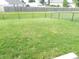 Grassy backyard is fully fenced in at 10178 Cornith Way, Avon, IN 46123