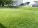 View of the grassy, fenced backyard and the back of the home at 10178 Cornith Way, Avon, IN 46123