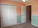 Bedroom features neutral carpet, half walls, and spacious closet space at 10178 Cornith Way, Avon, IN 46123