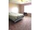 Bedroom with neutral carpet, natural light, and simple furnishings at 10178 Cornith Way, Avon, IN 46123