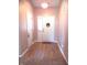 Inviting foyer featuring wood-look flooring and a charming 'Welcome Home' sign at 10178 Cornith Way, Avon, IN 46123