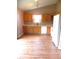 Bright kitchen featuring wood-look flooring, ample counter space, and essential appliances at 10178 Cornith Way, Avon, IN 46123