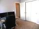 Spacious office with dual monitors, storage closet, and ceiling fan at 10178 Cornith Way, Avon, IN 46123