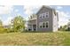 Backyard features a covered patio with a spa and hot tub area at 10262 Rieslaner Cir, Zionsville, IN 46077