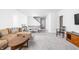 Finished basement features a comfortable seating area and a ping pong table at 10262 Rieslaner Cir, Zionsville, IN 46077