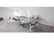 Finished basement area with a ping pong table and comfortable seating at 10262 Rieslaner Cir, Zionsville, IN 46077