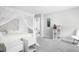 Airy bedroom featuring a canopy bed, modern decor, and a glimpse into the bathroom at 10262 Rieslaner Cir, Zionsville, IN 46077