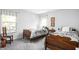 Bright bedroom featuring two twin beds, natural light, and neutral decor at 10262 Rieslaner Cir, Zionsville, IN 46077