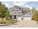 Beautiful two-story home featuring a three-car garage, dormer, manicured lawn, and inviting curb appeal at 10262 Rieslaner Cir, Zionsville, IN 46077