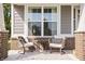 Charming front porch with cozy seating area and stylish outdoor decor at 10262 Rieslaner Cir, Zionsville, IN 46077