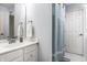 Bathroom featuring a blue shower curtain and white vanity, creating a refreshing and functional space at 1037 Deer Lake Dr, Carmel, IN 46032