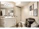 Well-lit bathroom featuring a modern vanity, stylish mirror, and elegant decorative accents at 1037 Deer Lake Dr, Carmel, IN 46032