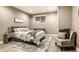 Cozy bedroom with neutral tones, stylish furnishings, and a comfortable queen-sized bed at 1037 Deer Lake Dr, Carmel, IN 46032