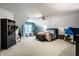 A bedroom features vaulted ceilings, a ceiling fan, a storage cabinet, and a window with natural light at 1037 Deer Lake Dr, Carmel, IN 46032