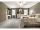 Bedroom featuring a white metal bed frame, ceiling fan, dresser, and a desk for versatile use of the space at 1037 Deer Lake Dr, Carmel, IN 46032