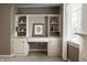 Built in desk with shelving, perfect for home office or study space; bright light from a window nearby at 1037 Deer Lake Dr, Carmel, IN 46032