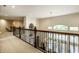 Second story view of the foyer featuring a wood banister, chandelier, and arched window at 1037 Deer Lake Dr, Carmel, IN 46032