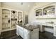 Bright home office with custom shelving, a vaulted ceiling, and an oversized desk at 1037 Deer Lake Dr, Carmel, IN 46032