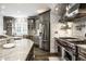 Modern kitchen showcasing stainless steel appliances, stone countertops, and custom cabinetry at 1037 Deer Lake Dr, Carmel, IN 46032