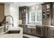 Updated kitchen with granite counters, stainless appliances, and a farmhouse sink at 1037 Deer Lake Dr, Carmel, IN 46032