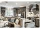 Contemporary kitchen featuring stainless appliances, granite counters, custom cabinetry, and breakfast nook at 1037 Deer Lake Dr, Carmel, IN 46032