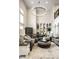 Spacious living room featuring a high ceiling, modern lighting, and stylish decor at 1037 Deer Lake Dr, Carmel, IN 46032