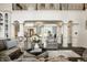 Elegant living room featuring high ceilings, hardwood floors, and stylish furniture at 1037 Deer Lake Dr, Carmel, IN 46032