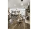 Open-concept living space with fireplace, hardwood floors, and cozy seating area at 1037 Deer Lake Dr, Carmel, IN 46032